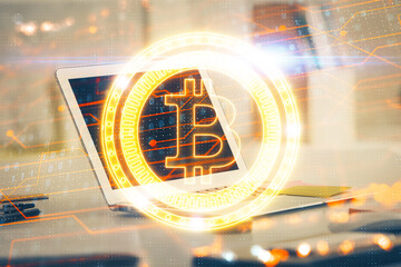 Multi exposure of blockchain theme hologram and table with computer background. Concept of bitcoin...