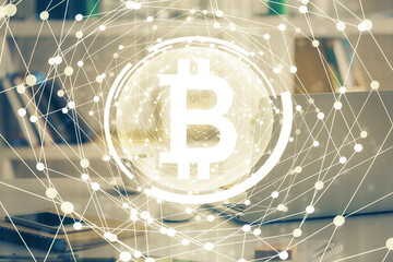Multi exposure of blockchain theme hologram and table with computer background. Concept of bitcoin...