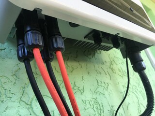 Cables and inputs. Red and black cables with visor. Electricity power. 