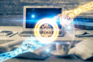 Multi exposure of blockchain theme hologram and table with computer background. Concept of bitcoin crypto currency.
