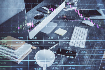 Double exposure of graph and financial info and work space with computer background. Concept of international online trading.