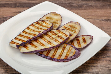 Grilled graffiti eggpant slices with oil