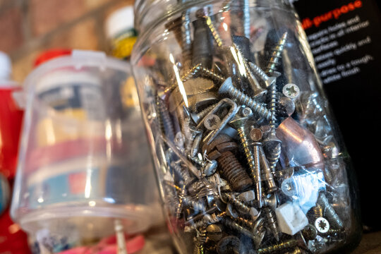 Jar of random parts, nails, screws, bolts