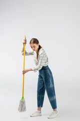 attractive girl posing like puppet isolated on grey