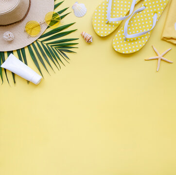 Summer is coming frame. Vacation yellow beach accessories on a color background. Flat lay with copy space for your promo text