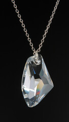 Pendant from one large glass crystal on a chain. 