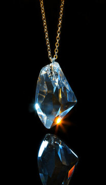 Pendant from one large glass crystal on a chain. 