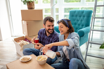 Couple eating breakfast in their new home