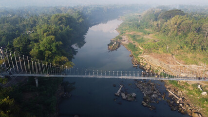 aerial view of a suspension bridge that crosses the Opak river in Bantul. Yogyakarta Indonesia