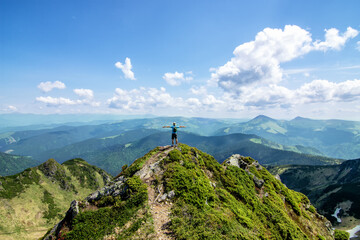 Fototapeta premium Man on top of mountain. Conceptual design. At the top of the mountain in the Ukrainian Carpathians, Marmarosh ridge