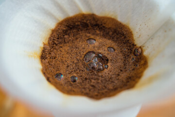 Third wave coffee preparation with a V60 method. Specialty coffee concept.