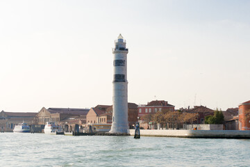 The beautiful lighthouse of Murano, the island in Venice lagoon famous for the glass production.From time to time there has always been a lighthouse here, this new one is made of white istria stone