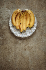 Bananas on a concrete background. The view from the top. Art.