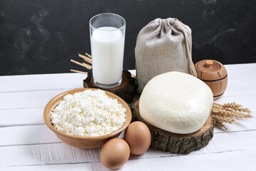 Glass of milk and Dairy products on background
