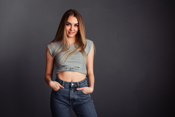 The girl piercingly looks right on the gray wall