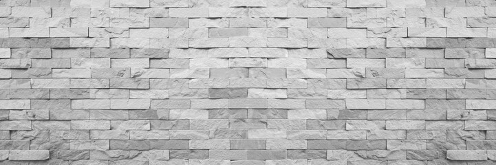 Grey aged natural sand stone walling for texture and design background