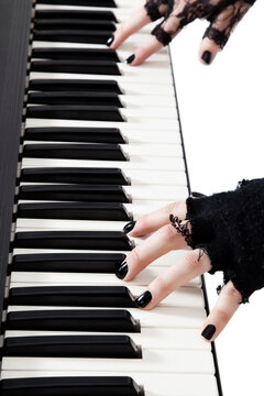 Female goth band playing keyboard piano