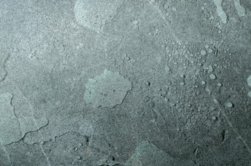 Top view of gray wet surface as a background.Empty space