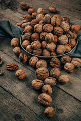 Nuts on an old wooden background. The view from the top. Art.