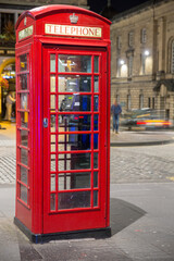 Classic red British telephone box, night scene