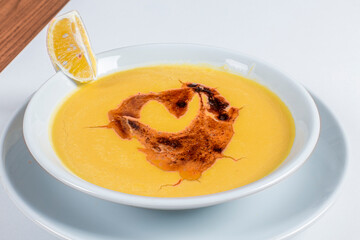 Turkish Traditional lentil Soup with bread on white rustic wooden background, mercimek corbasi.
