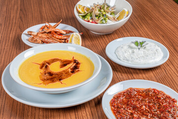 Turkish Traditional lentil Soup with bread on white rustic wooden background, mercimek corbasi.
