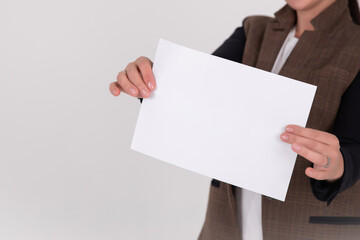 young business woman showing blank sign board, over studio background isolated