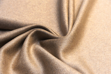 The texture of cashmere fabric beige. Background, pattern.
