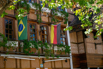 Campos do Jordão, São Paulo, Brazil - May 26, 2020: flags of Brazil and Germany in a commercial establishment in the city's tourist square.