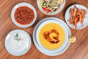 Turkish Traditional lentil Soup with bread on white rustic wooden background, mercimek corbasi.