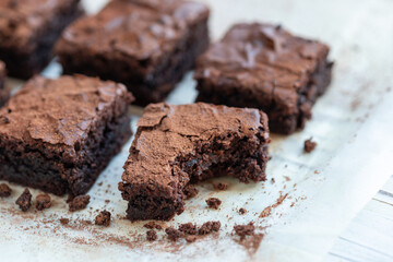 Closeup of homemade brownies with a bite taken