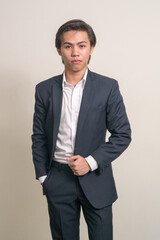 Portrait of young Filipino businessman in suit
