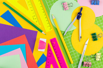 Composition with school stationery on color background. Creative flat lay back to school concept. various writing tools and other school stationary