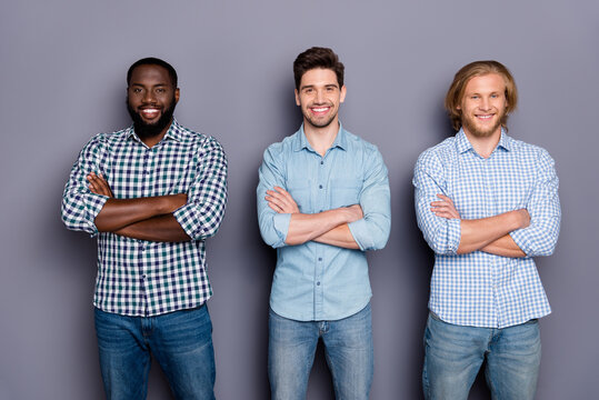 Portrait of three nice attractive cheerful content guys best buddy fellow international variety team coworkers folded arms isolated over gray purple pastel color background