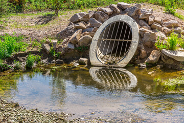 Water drainage pipe prevening from flooding land.