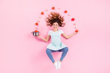 Top above high angle view full size photo of positive housewife girl prepare tasty delicious eco bio soup juggle tomato mushrooms throw saucepan flat lay isolated pastel color background