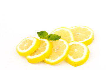 Group of lemons with mint leaves, isolated on white background