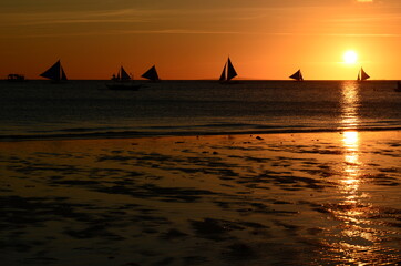 Sailing boats at sunset. Boracay island. Aklan. Western Visayas. Philippines