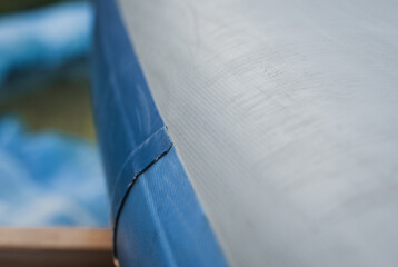 a damaged supboard close-up, scratches on PVC,