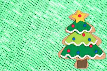 Gingerbread Christmas tree on green sparkle background