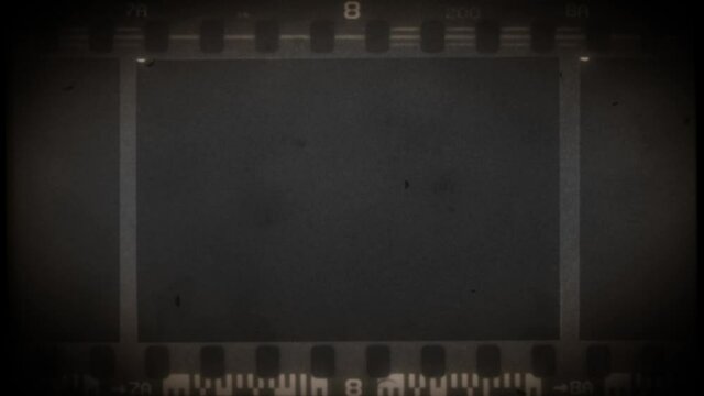 Vintage Old 35mm Filmstrip Background/ 4k animation of an old 35mm filmstrip with textures and noise effects
