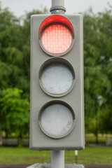 the traffic light is red and the STOP signal is on