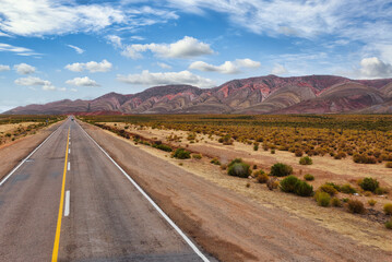 Cinematic road landscape. Humahuaca valley, Altiplano, Argentina. Misty road