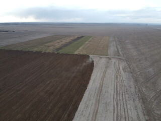 Agricultural machinery in the field, aerial view. Agricultural work.