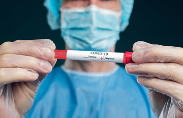 Unrecognizable medical practitioner demonstrating coronavirus test