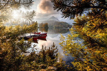 Incredible view of Strbske Pleso during sunset, Slovakia. Dramatic, picturesque scene. Popular tourist attraction. Location place National Park High Tatra. Europe. Artistic picture. Amazing Landscape.