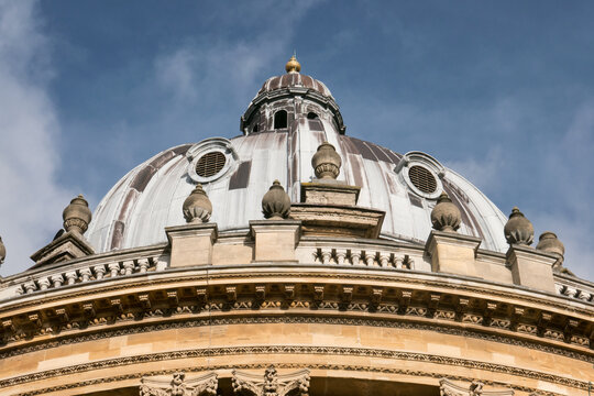 Radcliffe Camera Oxford dome against blue sky with light clouds