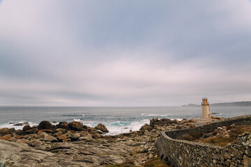Fototapeta na wymiar Old Lighthouse on the Rocky Coast of Finisterre, Spain