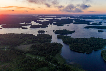 Sunrise over the islands of the water world in Karelia. Aerial view.