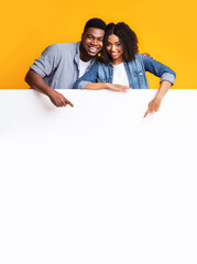 Blank Smiling Couple Pointing At Blank Advertisement Board, Recommending Something